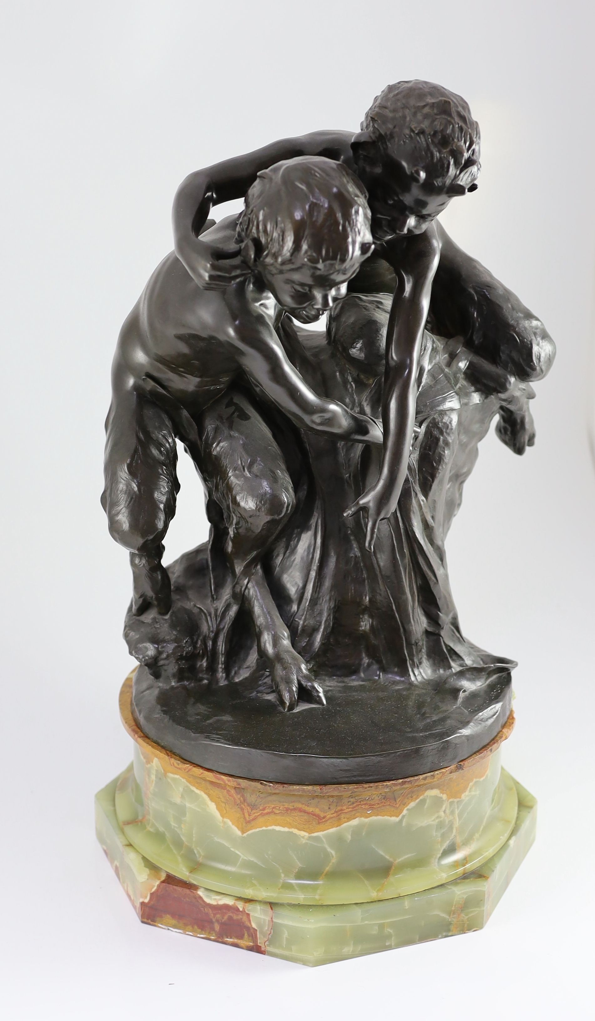 Raoul Larche (1860-1912). A bronze group of two fauns upon a riverbank looking at their reflection, height 57cm